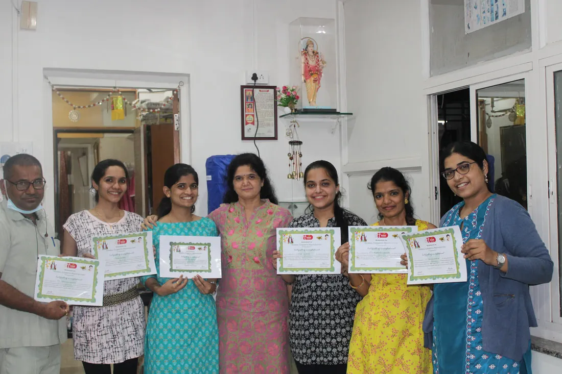 Dr. Nileema Shisode with six course participants holding their certificates at the clinic